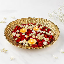 Load image into Gallery viewer, Lunara Bowl – gold hammered urli bowl styled with rose petals, jasmine and lit tealights for Diwali