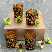 Load image into Gallery viewer, black and gold tea light holder, geometric patterns on each tea light