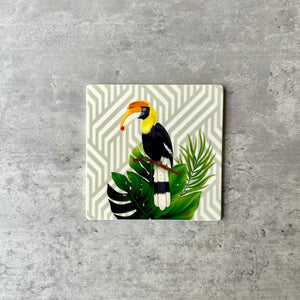 Geometric coaster with big toucan sitting on a branch

