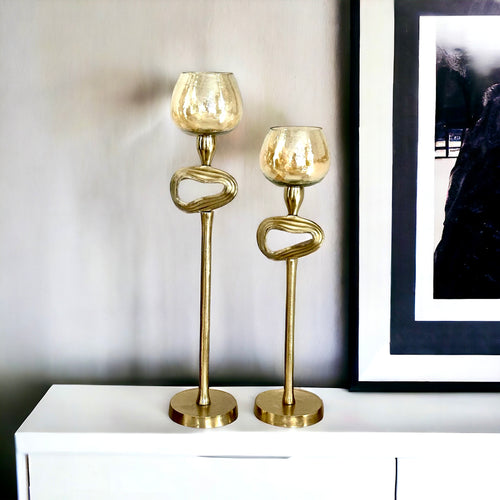 Gold tall candle stands with glass 