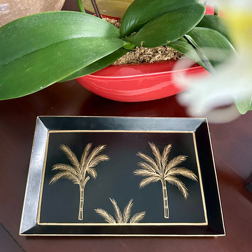 Amani Noir Collection with hand-painted gold palm motifs, ideal for décor or serving.