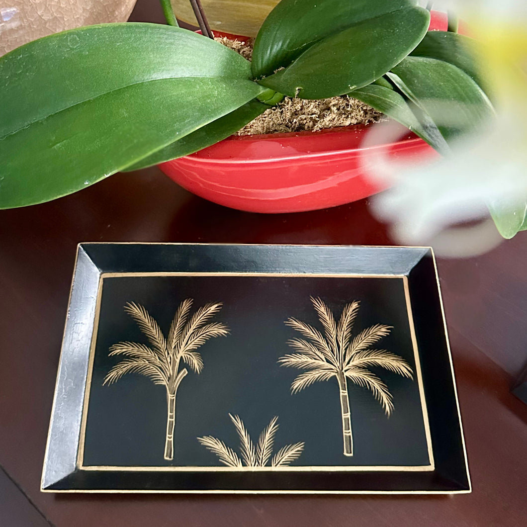 Amani Noir Collection with hand-painted gold palm motifs, ideal for décor or serving.