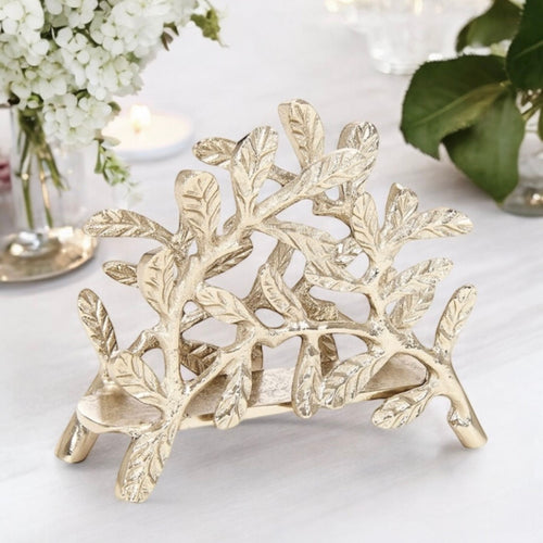 Pianta Napkin Holder in champagne gold by Meraki Lily, perfect for stylish and playful mealtime settings