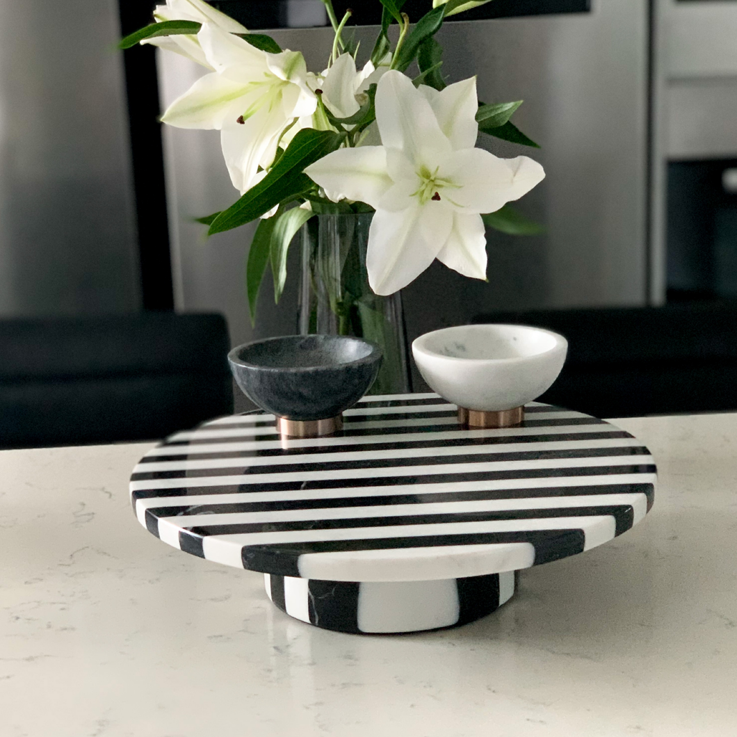 Amaya Cake Stand in black and white striped marble with a sleek, modern design, perfect for serving cakes or desserts stylishly. Modern and elegant design