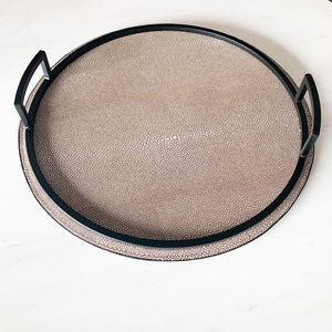Biege round leather tray with black handles, fine luxury and modern