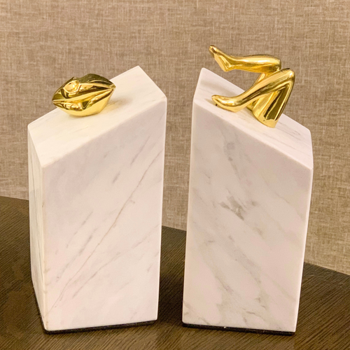 marble book ends with lips and legs, eclectic and modern
